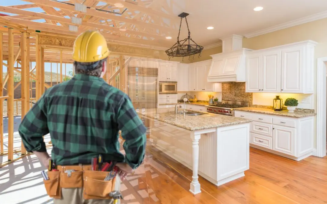 Construction worker envisioning finished kitchen design.