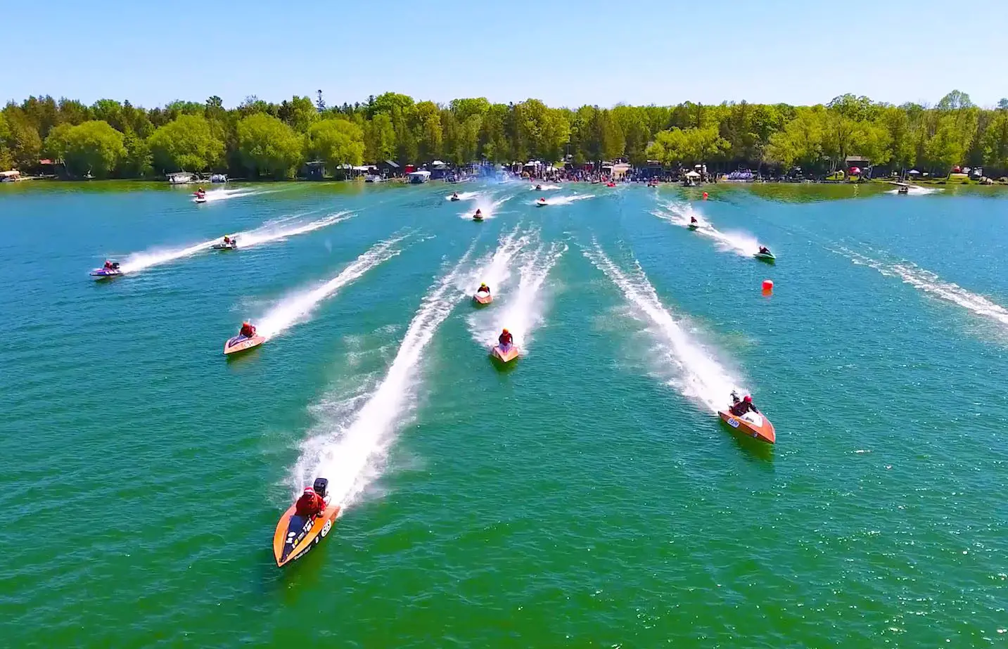 Speedboats racing across a lake.