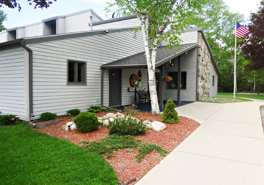 Modern house entrance with a welcoming walkway and landscaped garden.
